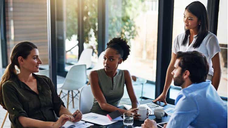 businesspeople having a meeting in a boardroom