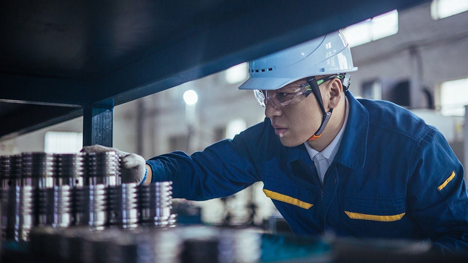 Logistics worker searching for a service part