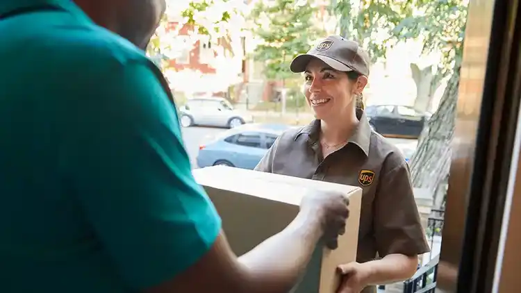 UPS woman driver at door