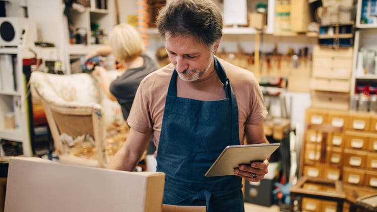 Man in shop with tablet