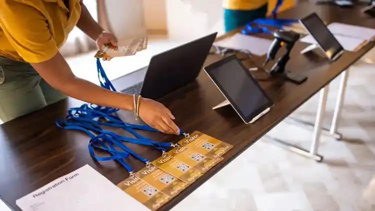 a person arranging business ID cards before a business conference